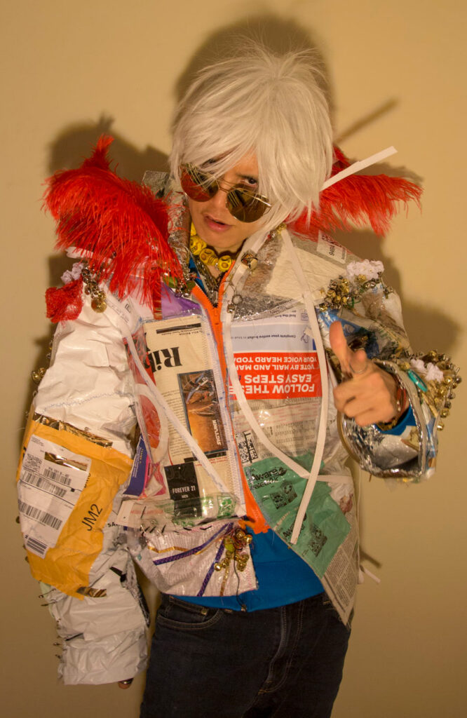 The jacket was constructed by draping collages on a mannequin to shape the jacket, creating a voluminous and structured form. I stitched in a zipper for easy wear and removal and added plastic linings both inside and out to make it rain-resistant.