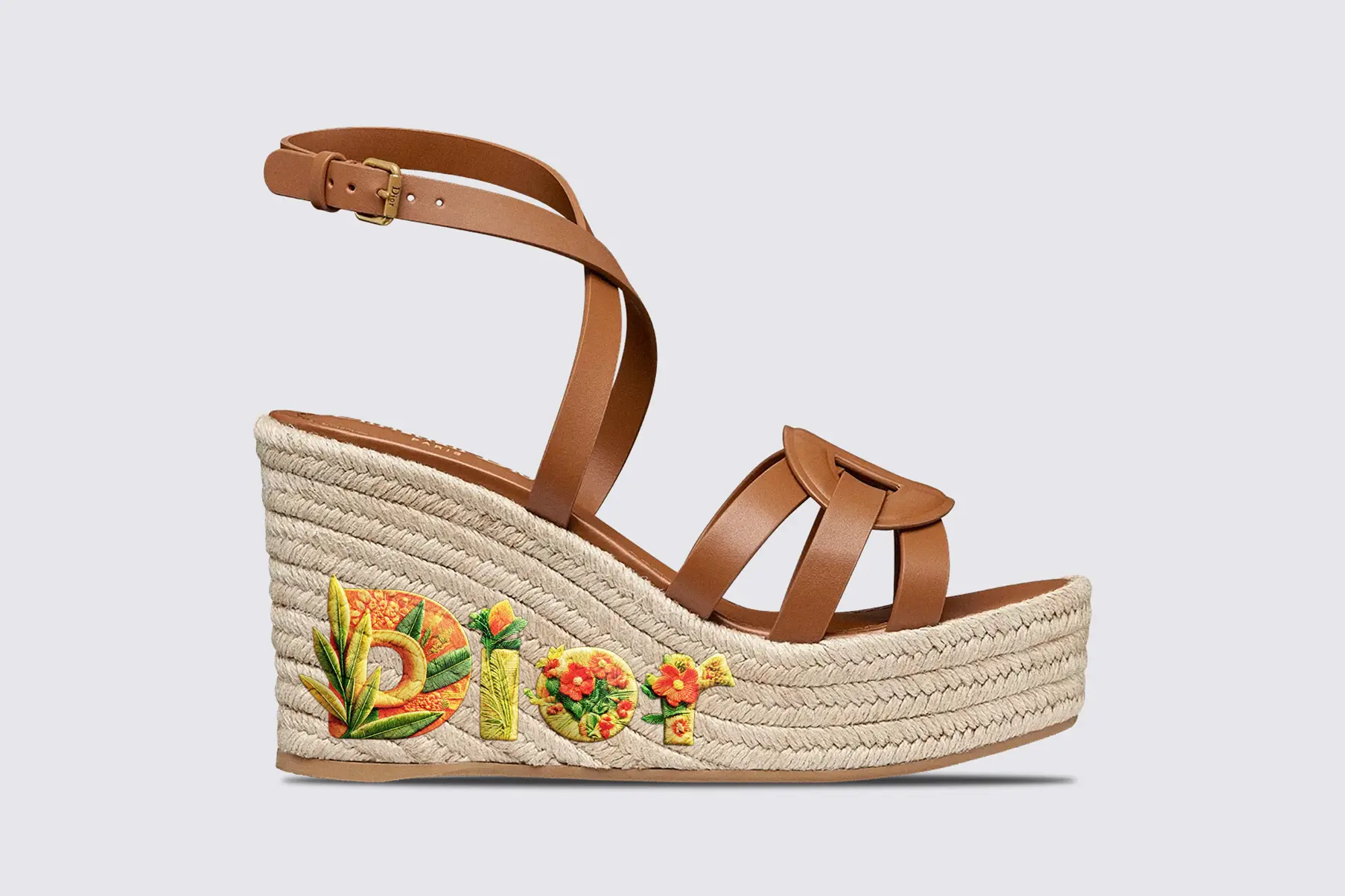 Dior D-Club Wedge Sandal in Camel Calfskin, featuring Chinoiserie floral detailing and the word “Dior” embroidered in Typorganik Display typeface.